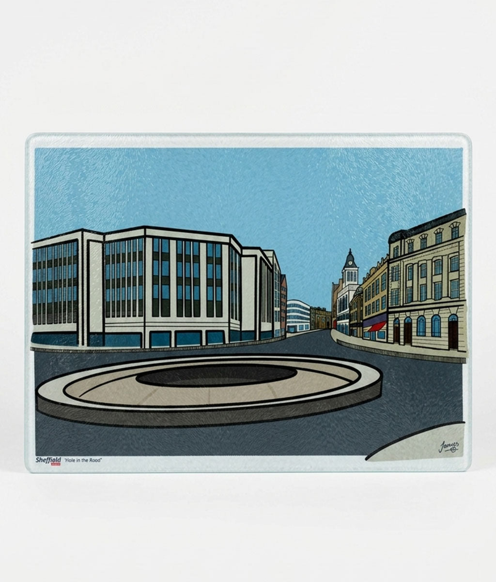 Illustration of a city street with buildings and a roundabout on a blue background on a glass chopping board