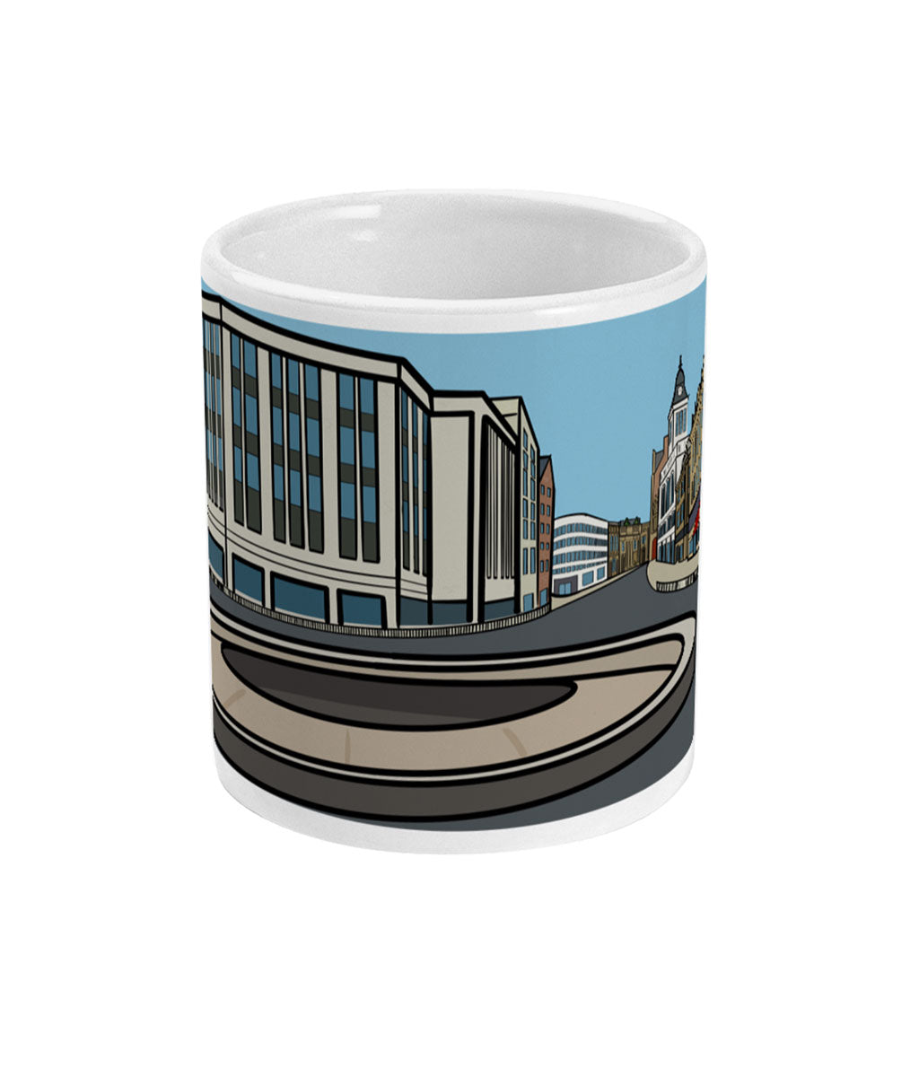 Mug with a cityscape design featuring buildings and a clock tower on a blue background