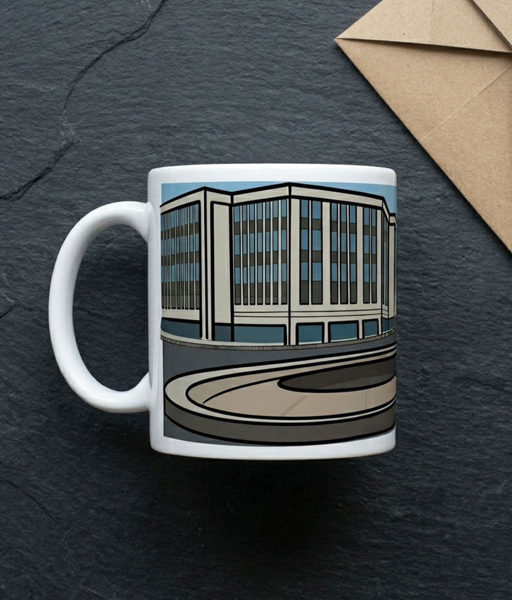 Mug with a building design on a dark surface