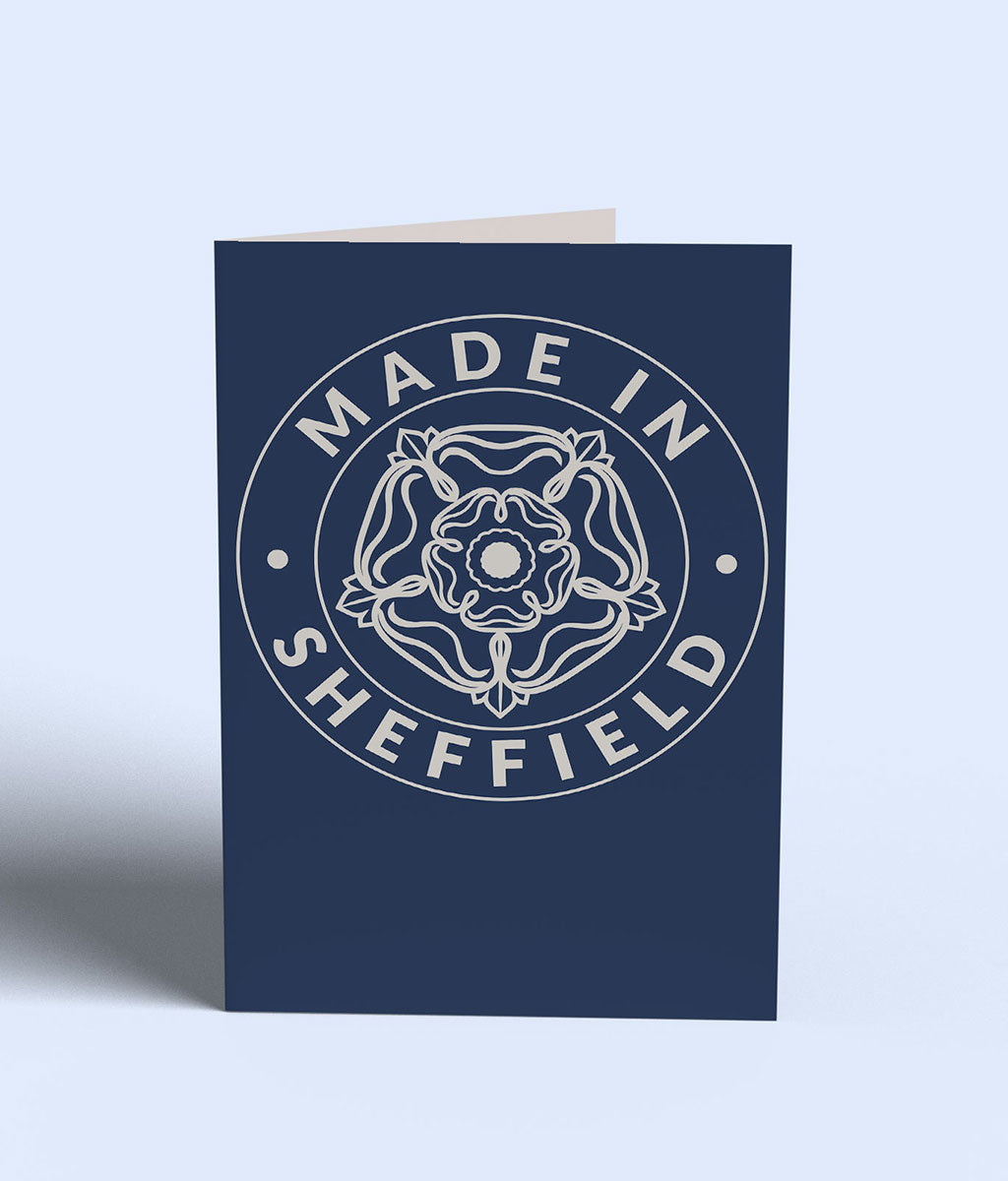 Navy blue card with 'Made in Sheffield' text and emblem on a light gray background