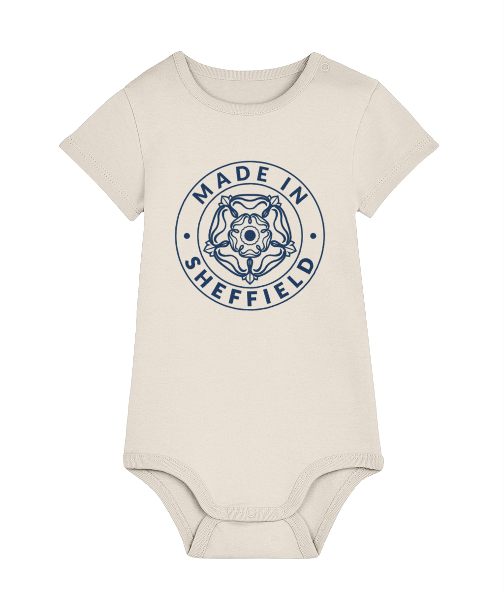 Beige baby onesie with 'Made in Sheffield' print on a white background