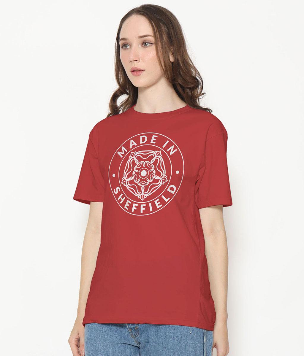 Person wearing a red t-shirt with 'Made in Sheffield' design on a white background