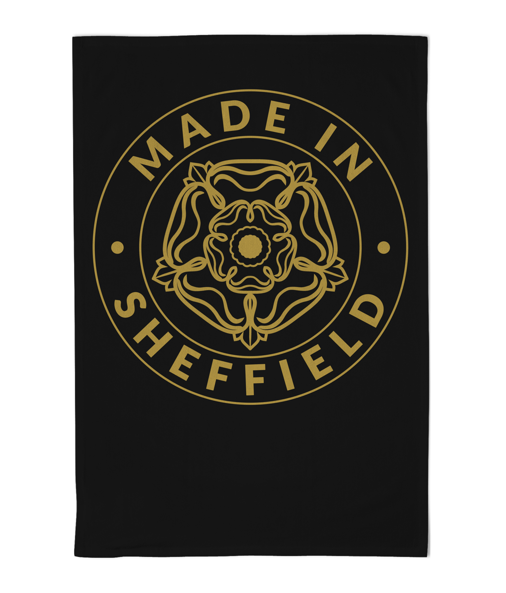 Black towel with gold 'Made in Sheffield' text and emblem on a white background