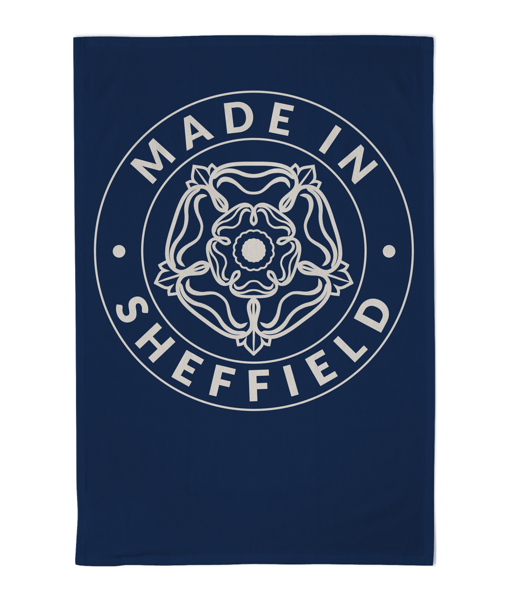 Navy blue towel with 'Made in Sheffield' text and emblem on a white background