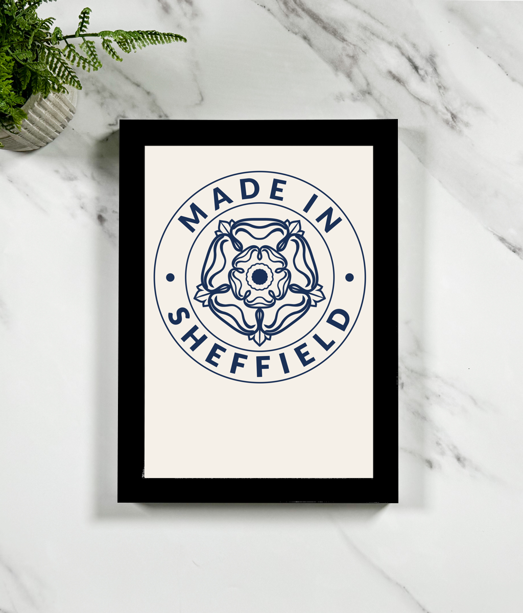 Framed print with 'Made in Sheffield' design on a marble surface.