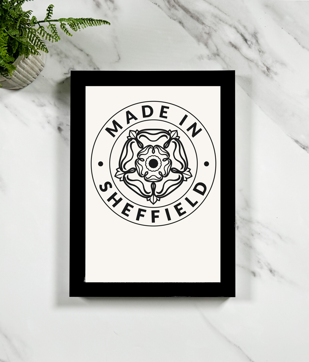 Framed print with 'Made in Sheffield' design on a marble surface.