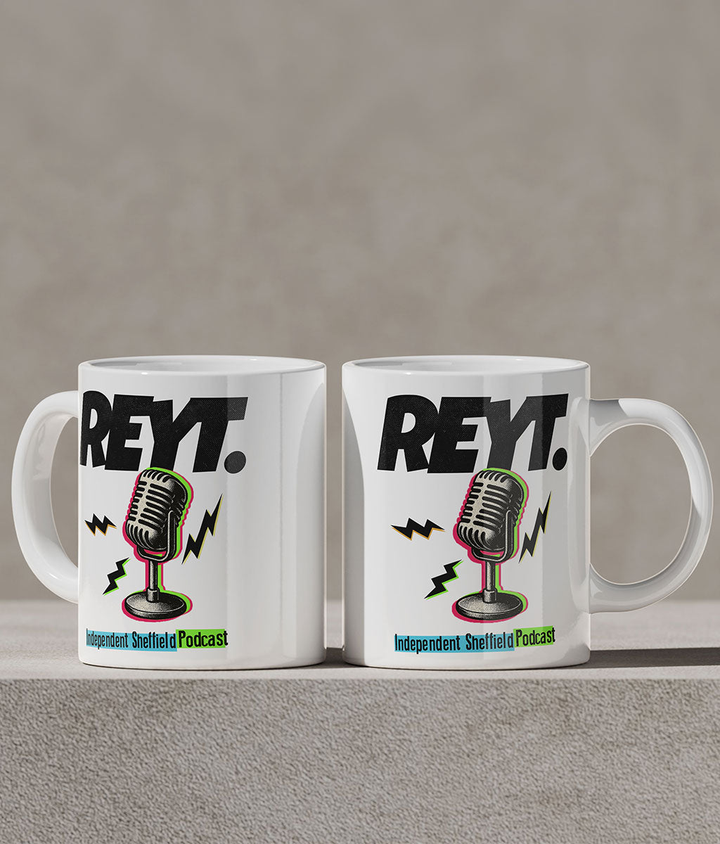 Two white mugs with a microphone graphic and 'REYT.' text on a gray background