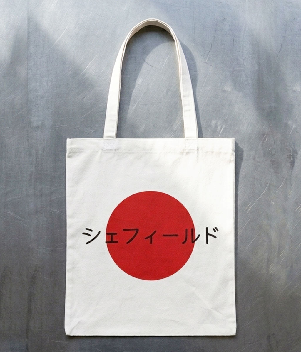 Tote bag with a red circle and Japanese text on a gray background