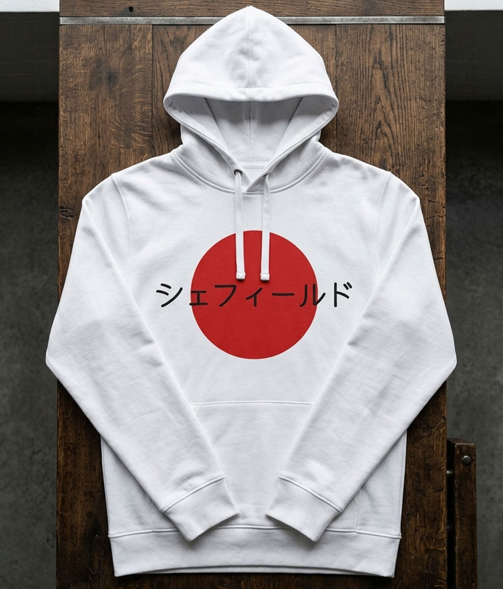 White hoodie with a red circle and text on a wooden surface