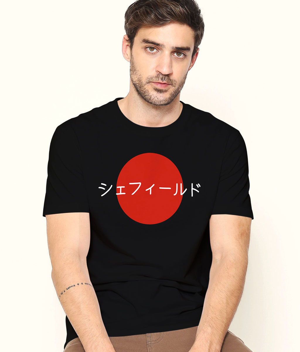 Man wearing a black t-shirt with a red circle and white text on a plain background
